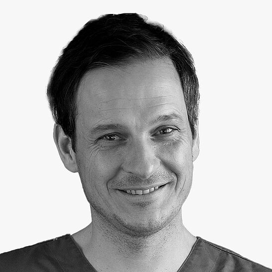 [Translate to Deutsch (Schweiz):] Portraitbild des Referenten in schwarz-weiß, Dr. Mathias Sperlich