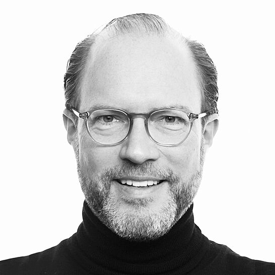 Portraitbild des Referenten in schwarz-weiß, Dr. Marquardt